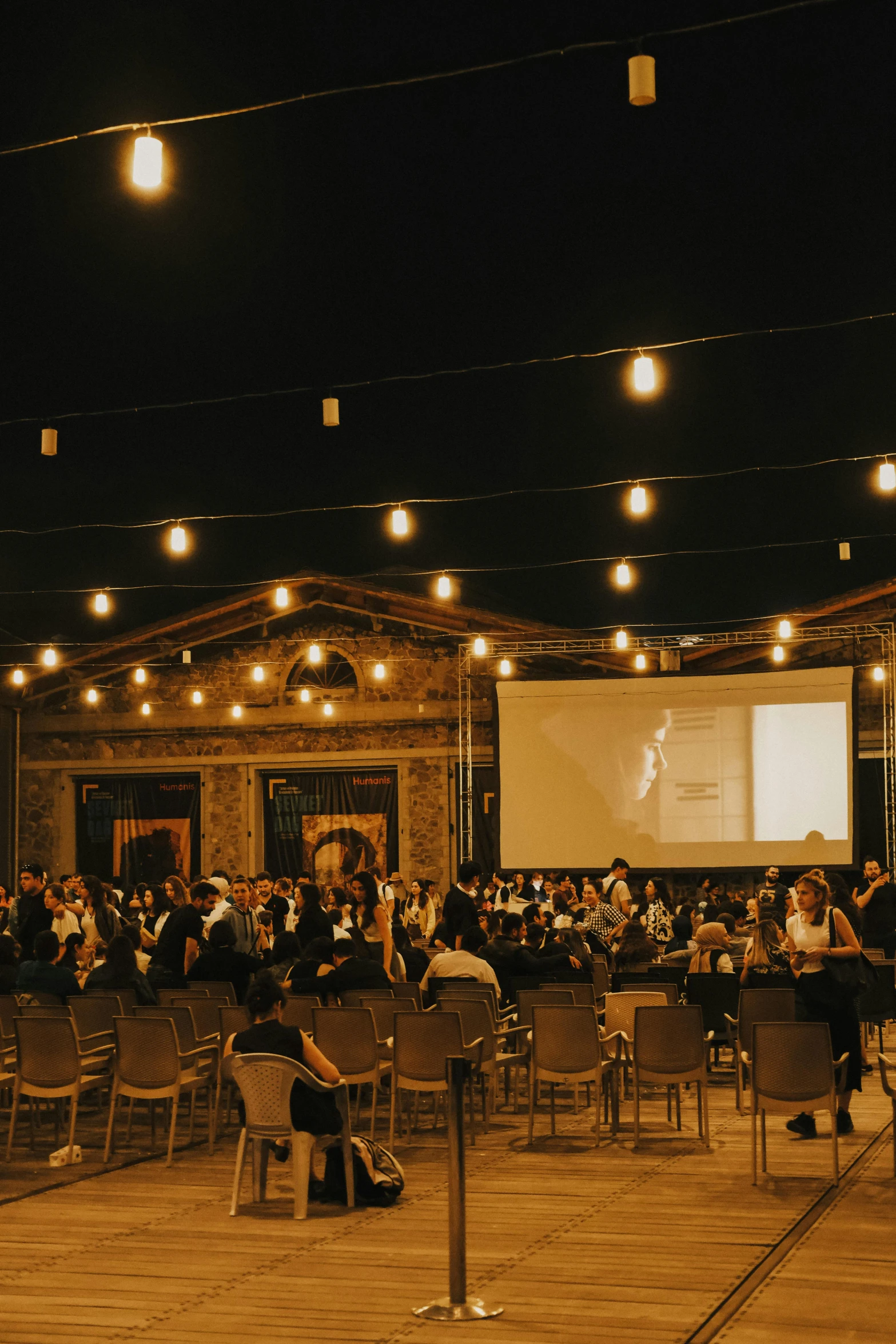 a group of people in an indoor movie theatre