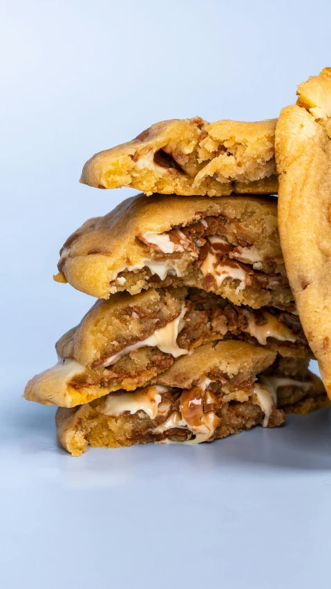 an orange is sitting between several cookies on a table