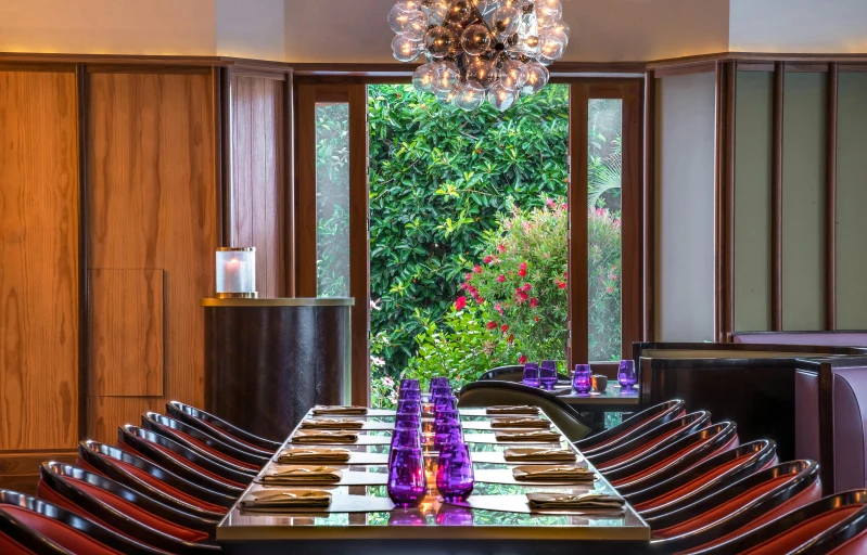 a large table with chairs and bottles on it