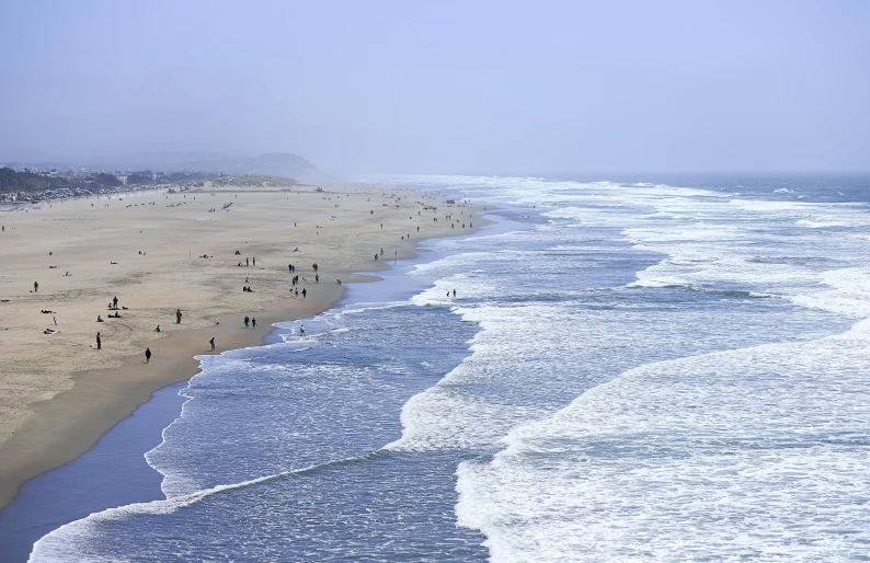 an image of people walking on the beach