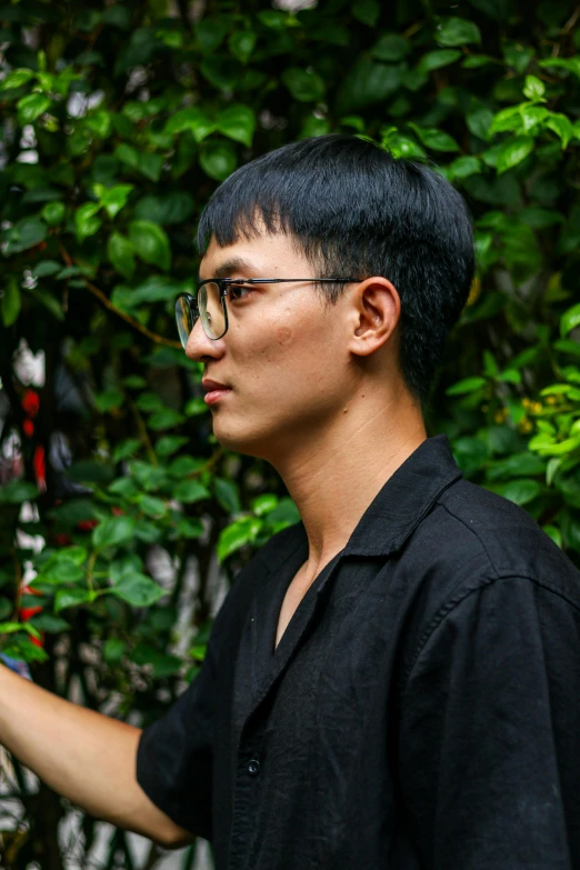 a man holding a banana in his right hand