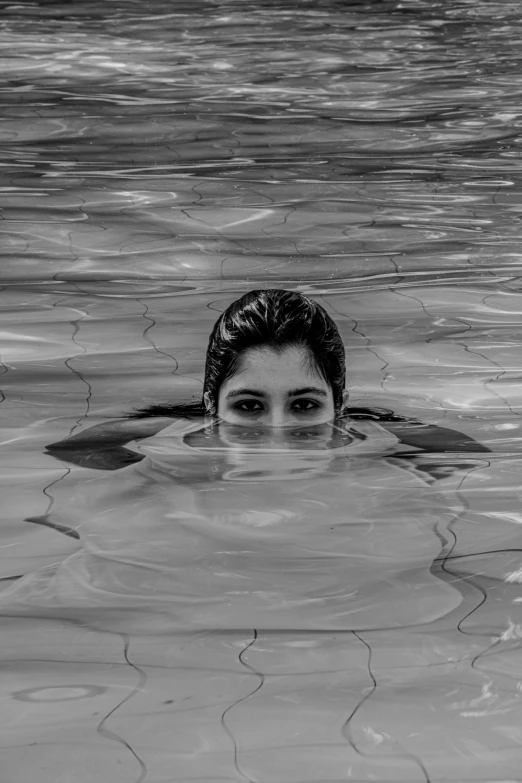 woman looking over the surface of the water