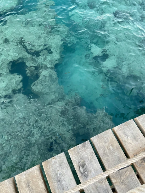 stairs lead into a deep blue water pool