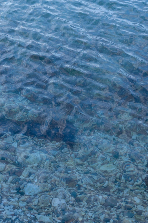 the water is very blue and the rocks are clear