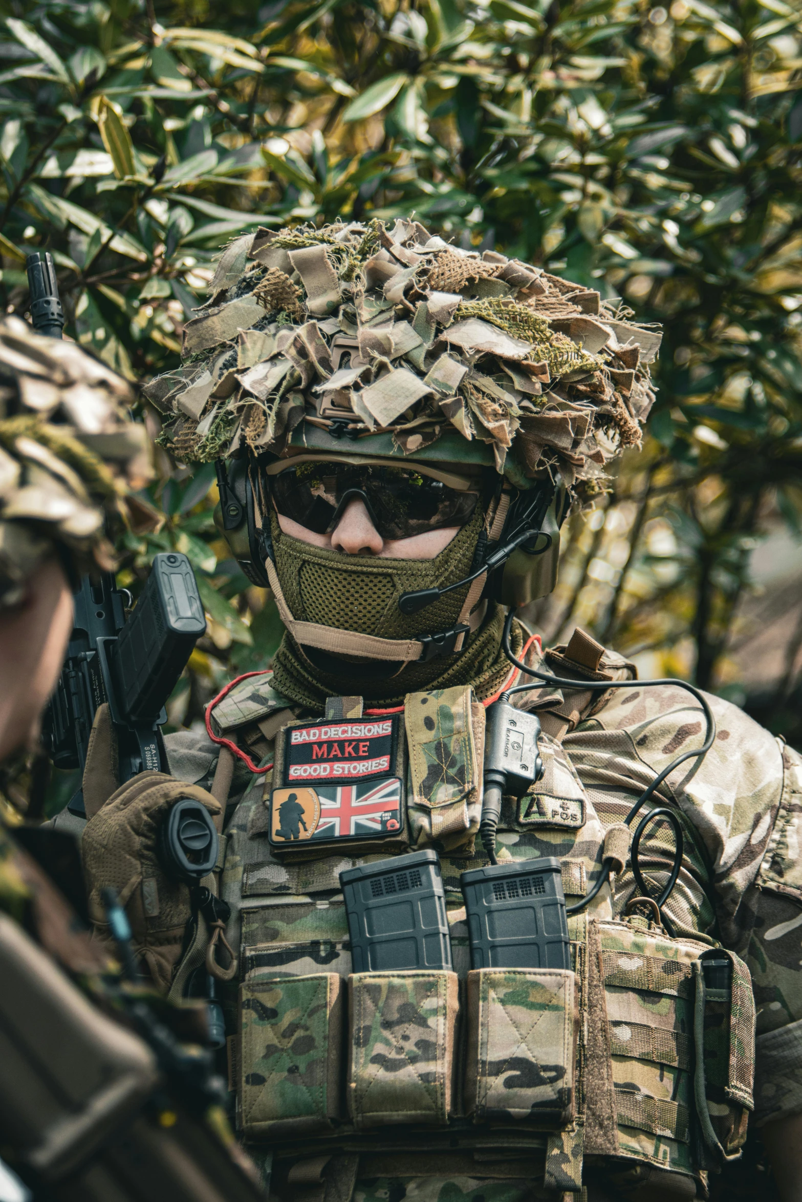 an australian soldier wearing camouflage gear and carrying a rifle