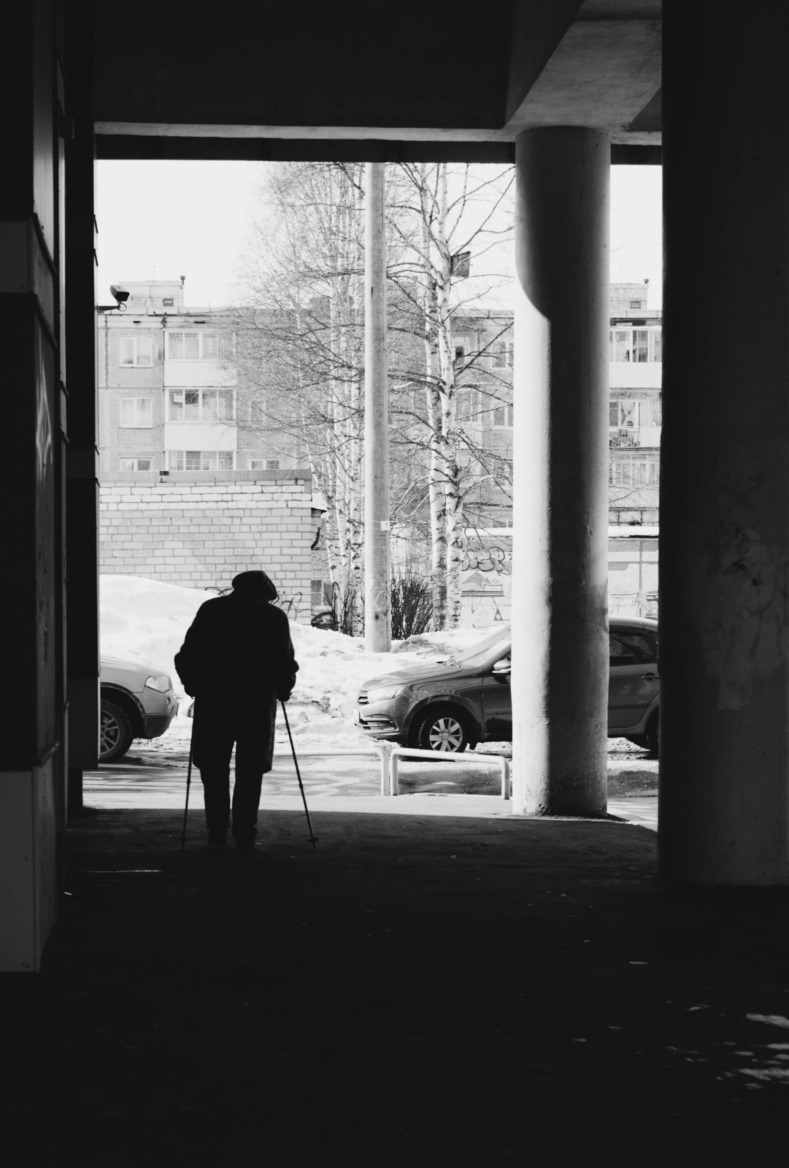 there is a person walking under the walkway