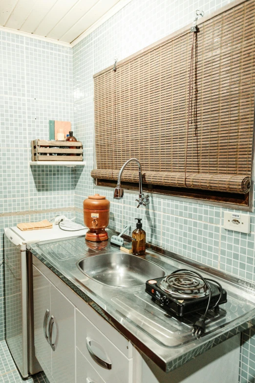 a kitchen with a sink and drying rack