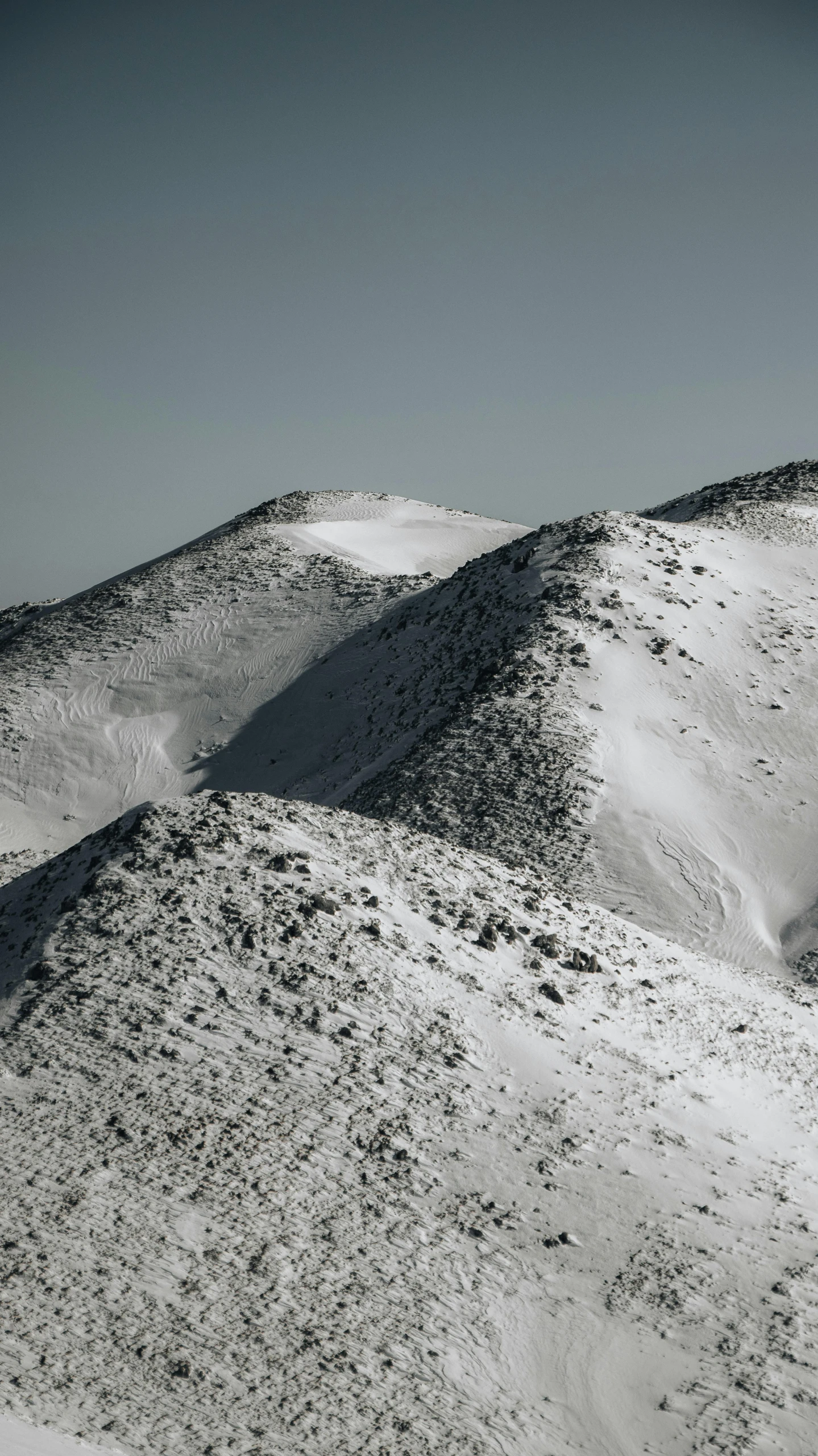 the snow covered mountains are shown in black and white