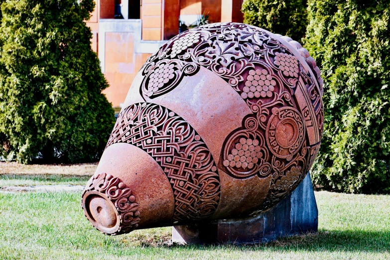 large statue of an intricately designed animal in a field