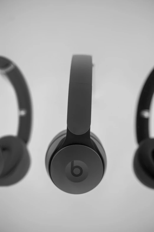 three headphones lined up in three positions