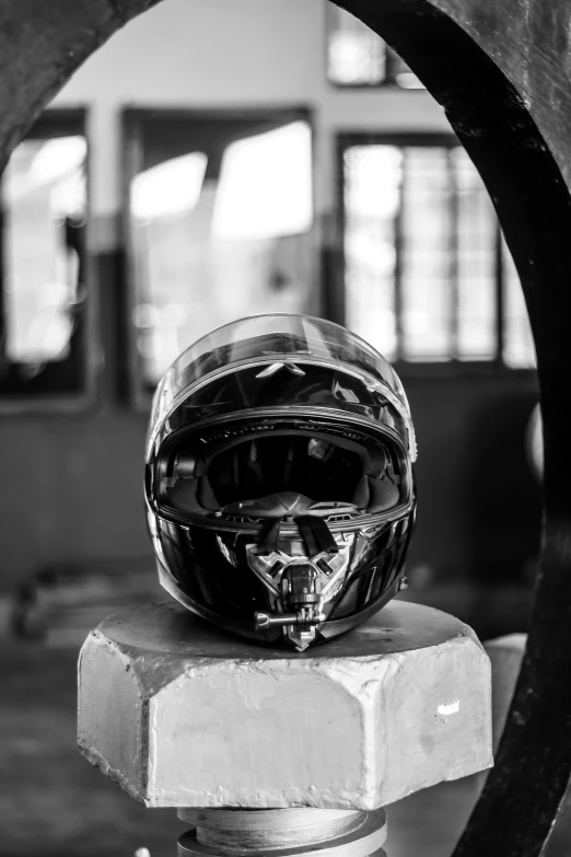 a black and white image of a helmet