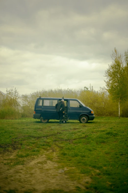 a man that is sitting in a van