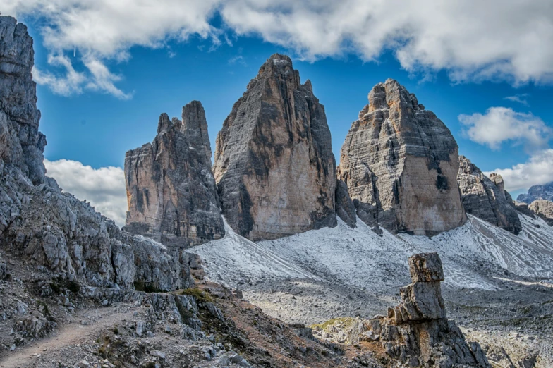 the rocky hills are covered with snow on a sunny day