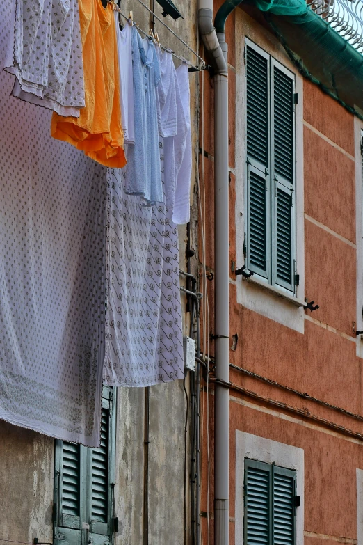 various types of towels drying outside on clothesline