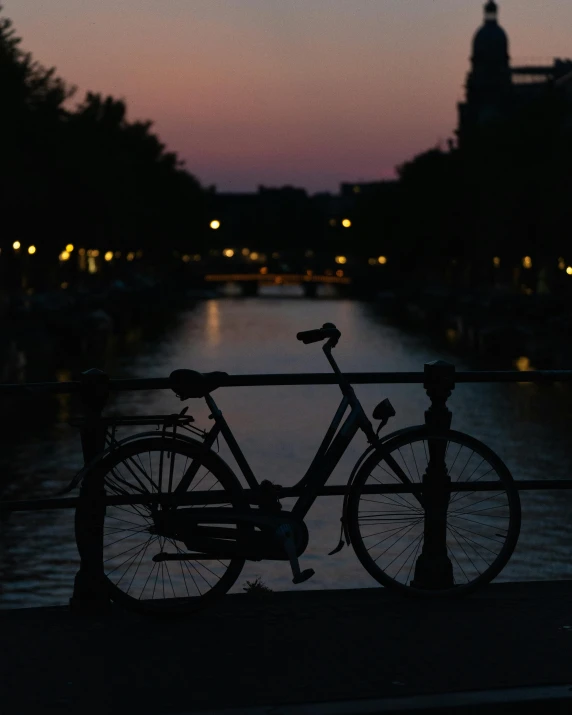 a bicycle parked near the top of a railing