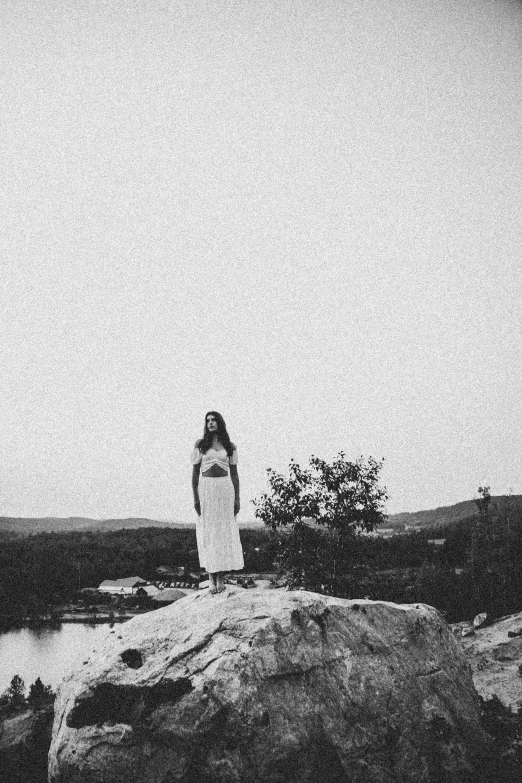 black and white po of a woman looking out over the plains