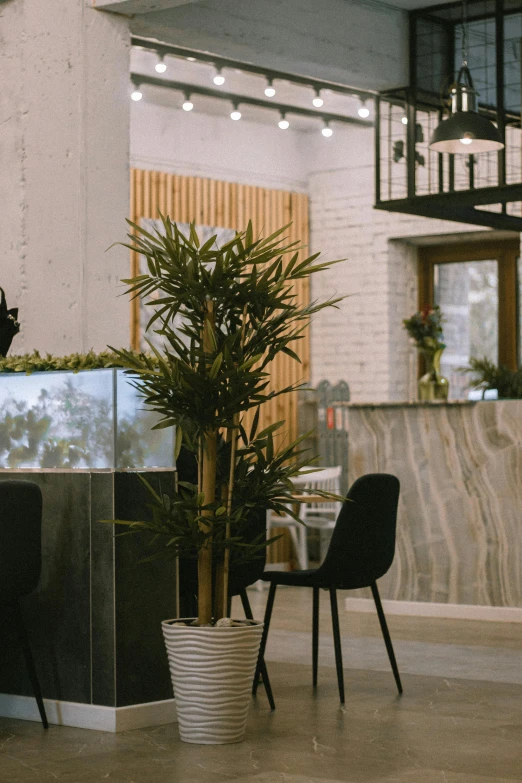 an office with tables and two chairs sitting at it