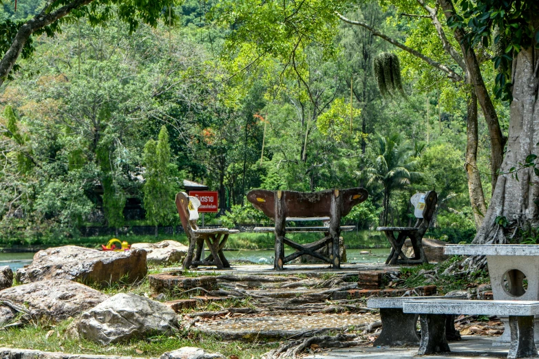 the picnic area has picnic tables and benches with benches to rest