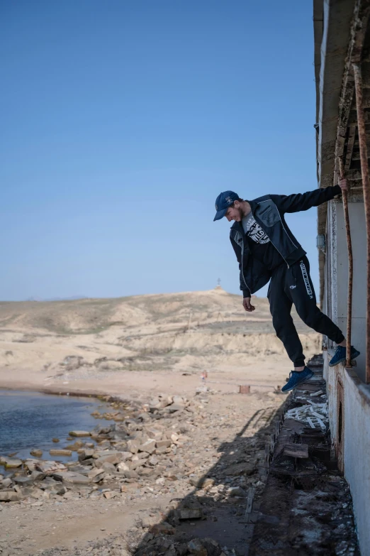 the man is doing tricks on his skateboard at the edge of a wall