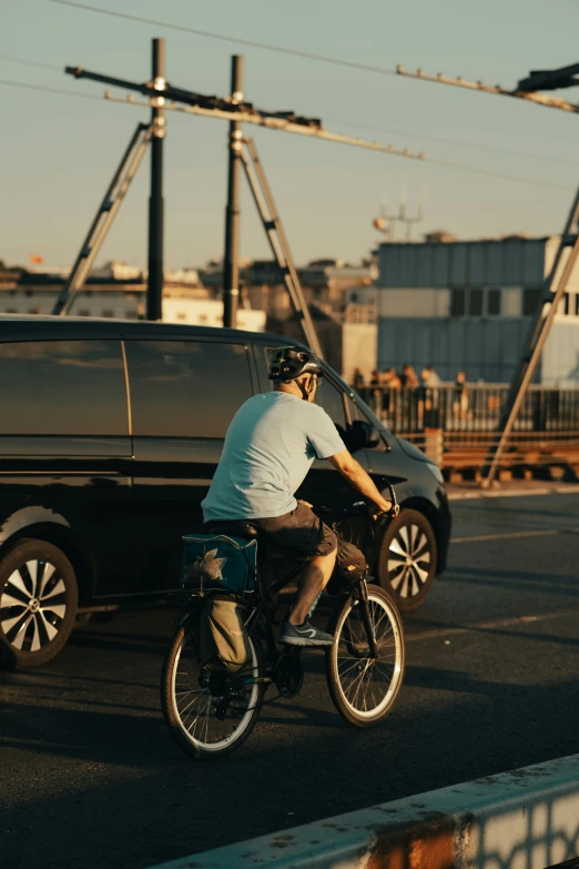 a man rides his bicycle along the street