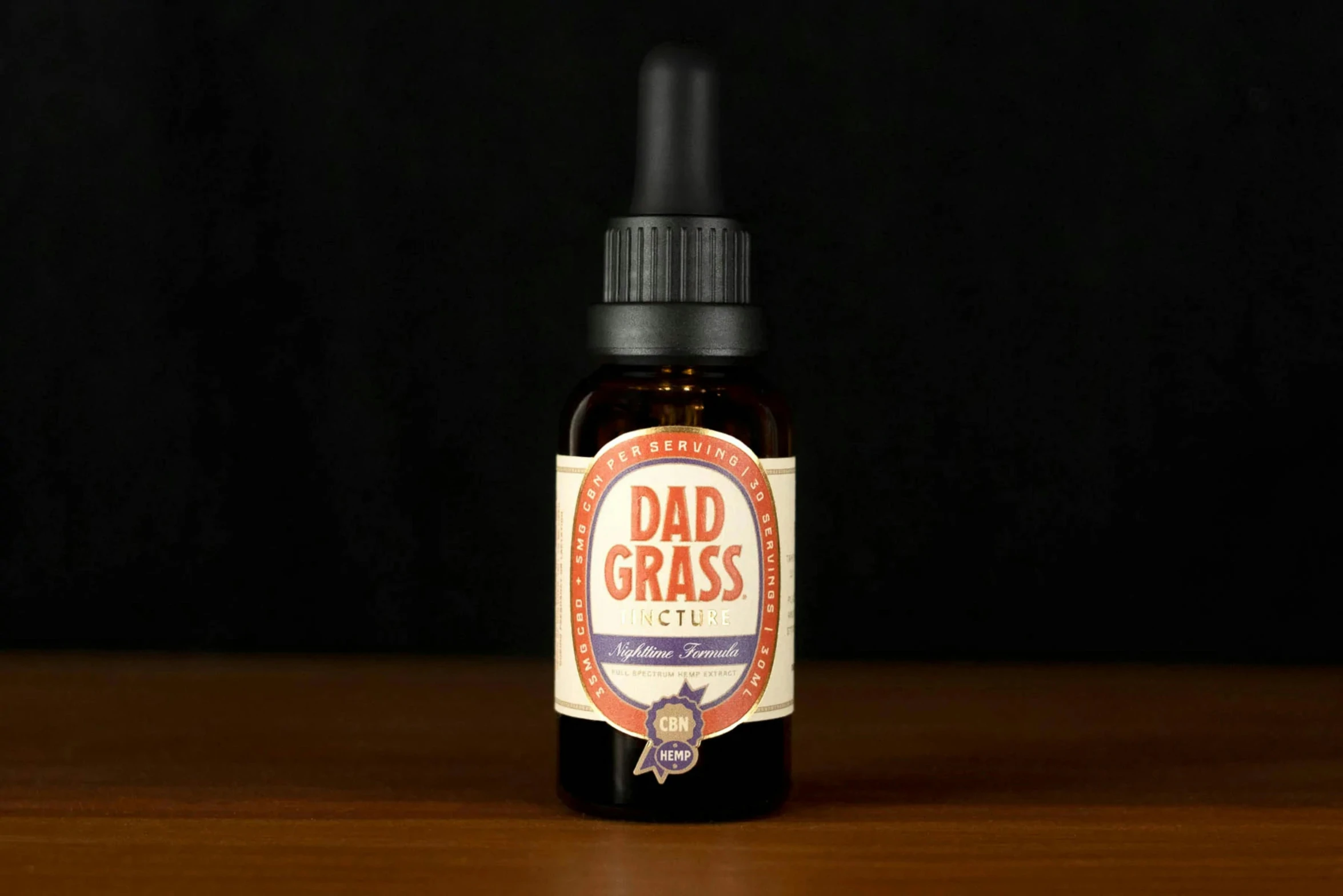 a bottle of dad gras liquid sitting on a table