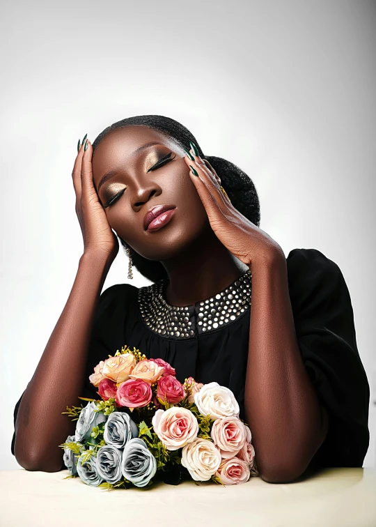 woman wearing black with flowers in front of her head