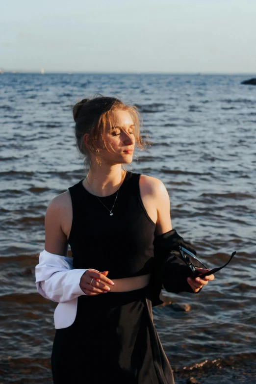 a woman with wrist guards by the water