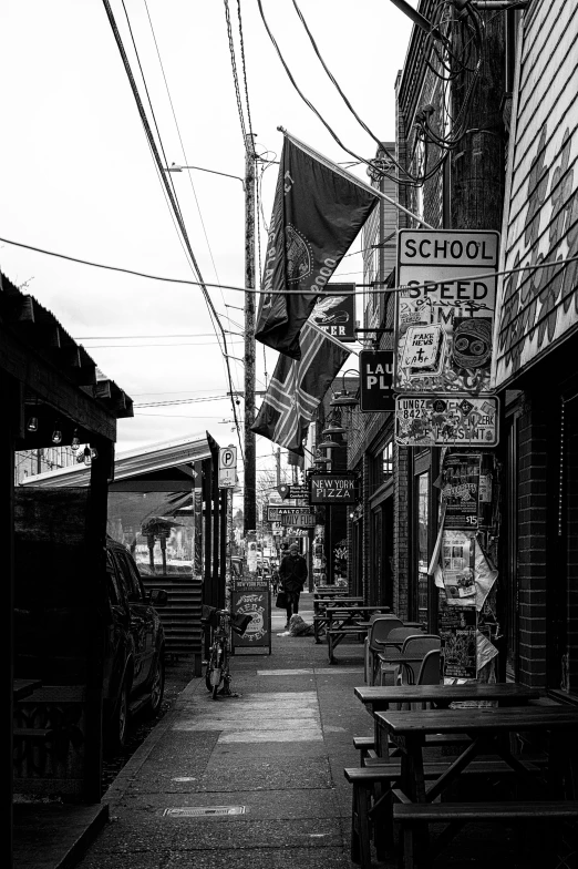 a black and white po of a street with signs