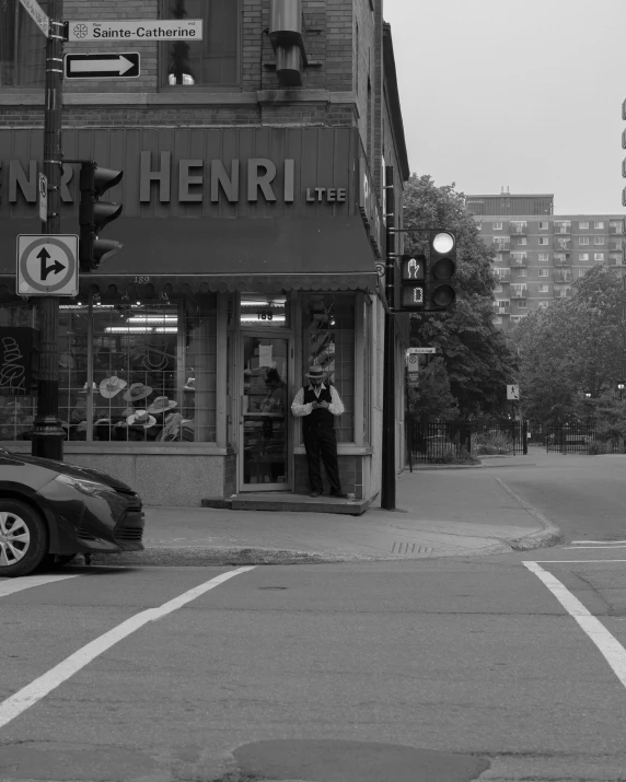 two people at the entrance to a building at a traffic light