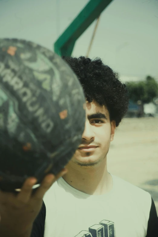 a man looking at a bowl in the mirror