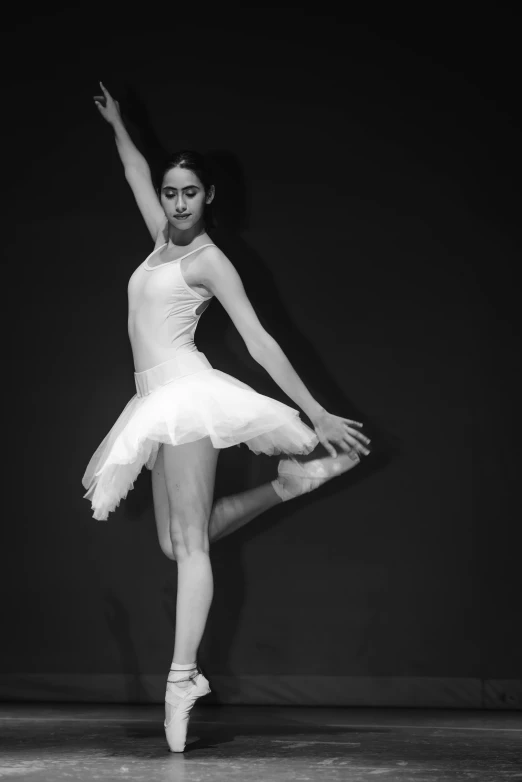 a black and white po of a ballerina