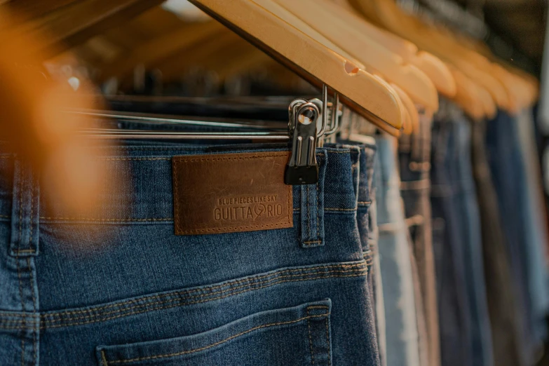 the jeans are lined up with the name tag