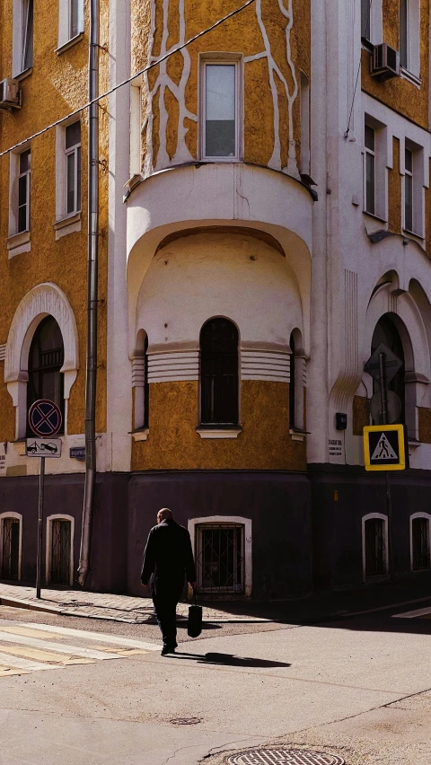 a person walking in front of some buildings