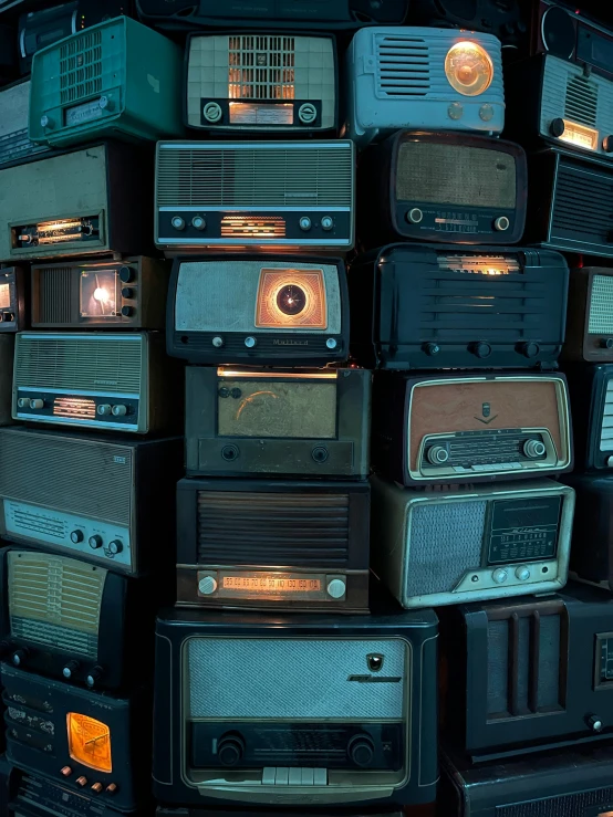 an old collection of old fashioned tvs