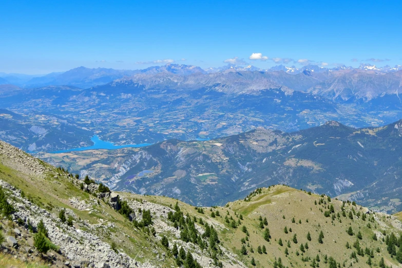 a beautiful view of mountains and the ocean in the distance