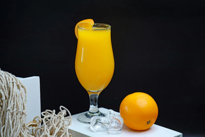 a drink and orange juice on display