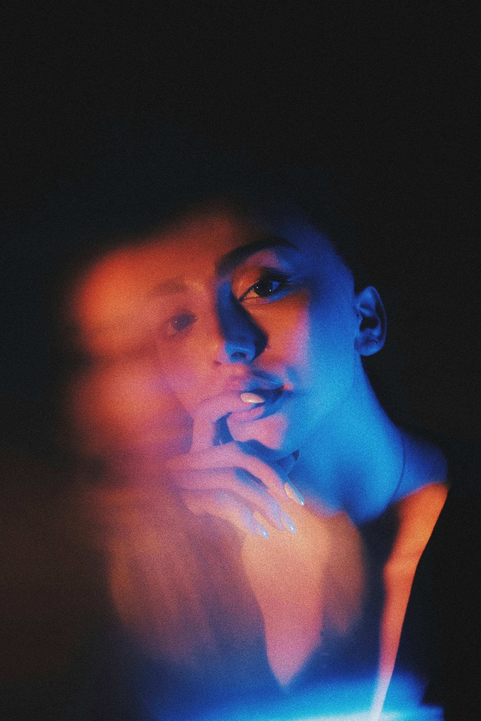 a male wearing a blue shirt and smoking a cigarette