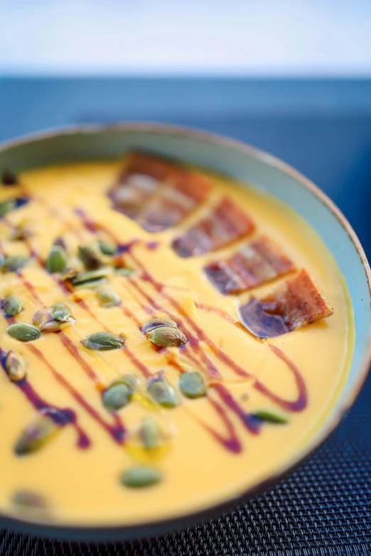 an orange dessert on a blue and green plate