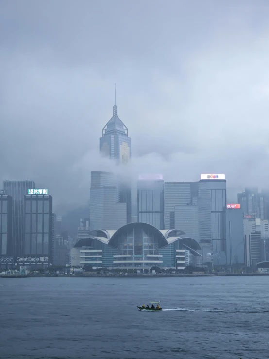 a boat on the water near city buildings