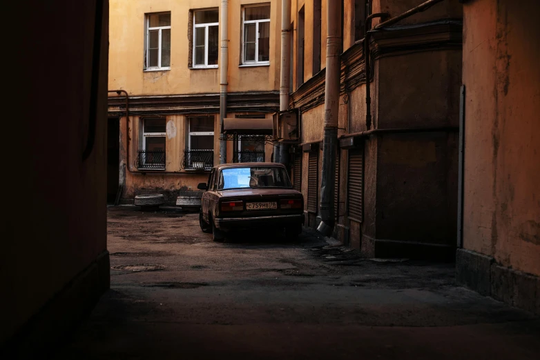 a small truck parked in an alley way