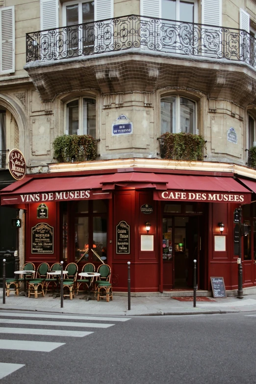 a red and brown building with french style furnishings