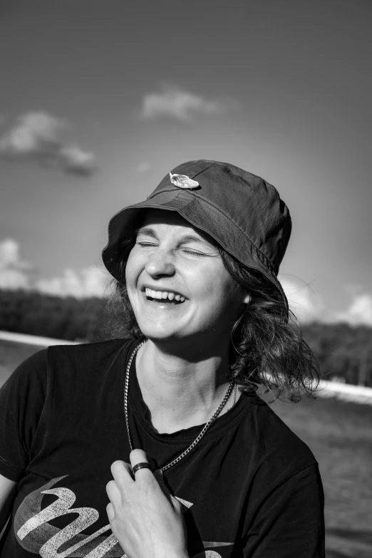 woman smiling and posing for camera on beach