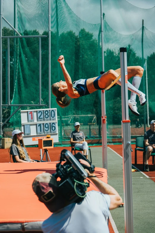 man jumping in air in open field on course