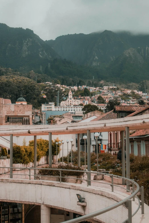 a bridge over looking buildings in a city