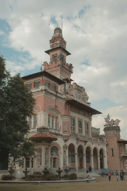 a large building has two towers at the top