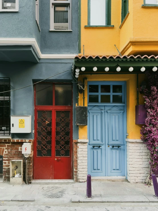 blue and red doors and windows are next to each other