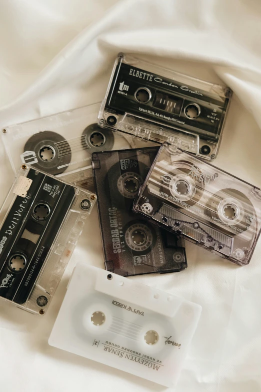 an assortment of music cassette's in various case