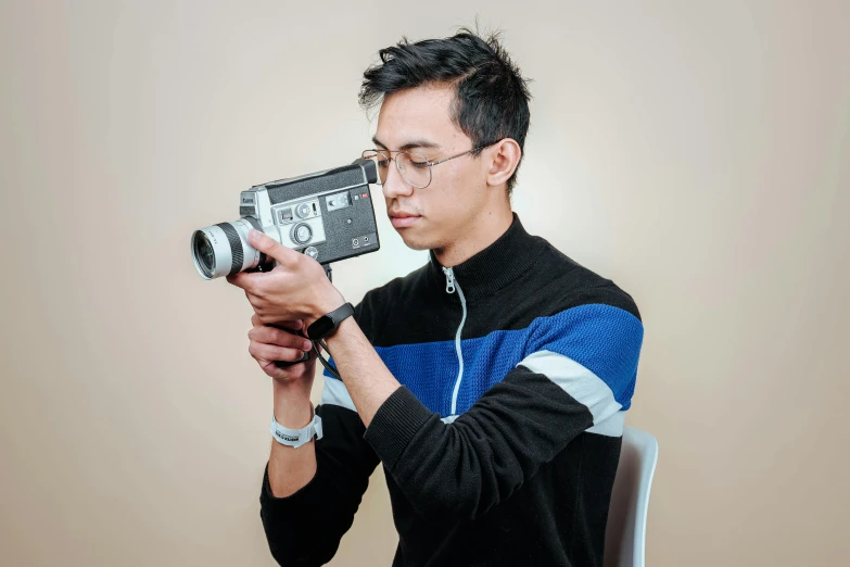 a man with a camera and a video camera