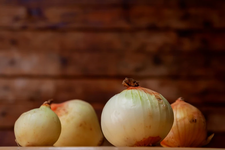 three onion slices sitting side by side, with one onion in the middle