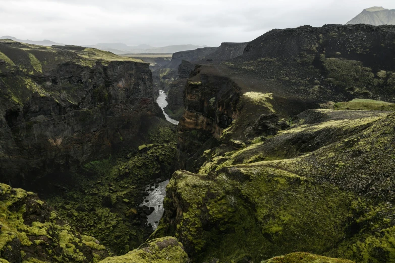 an empty gorge overlooks a river and a mountain